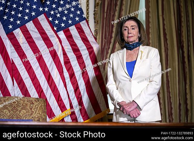 Speaker of the United States House of Representatives Nancy Pelosi (Democrat of California) listens during a bill enrollment ceremony for the Uyghur Human...