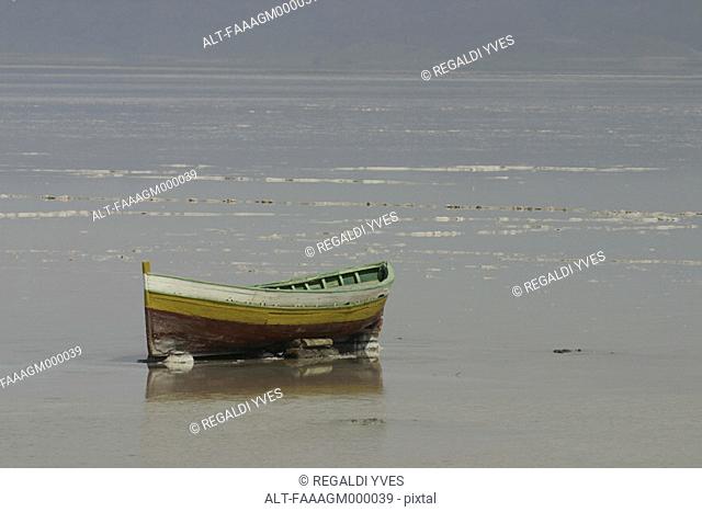 Tunisia, Chott El Jerid, rowboat on dry lakebed