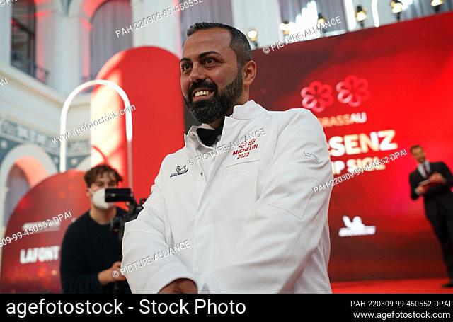 09 March 2022, Hamburg: Two-star chef Edip Sigl of the ""Es:senz"" restaurant in Grassau, Upper Bavaria, stands on stage during the 2022 Michelin Star Awards...