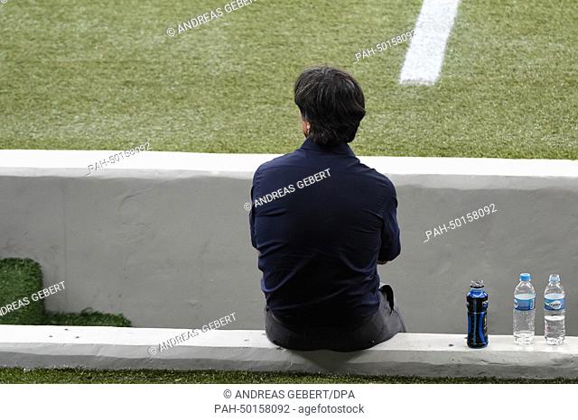 German head coach Joachim Loew sits on a wall during the FIFA World Cup 2014 semi-final soccer match between Brazil and Germany at Estadio Mineirao in Belo...