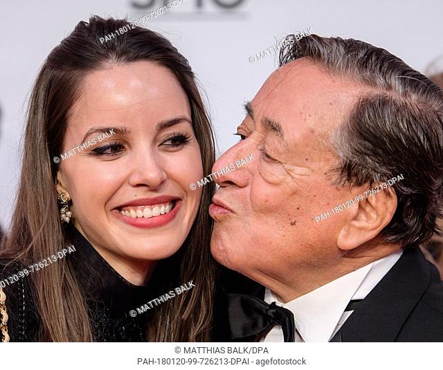 Business man Richard Lugner kissing his girlfriend Jasmin on the red carpet ahead of the 45th German Film Ball in the Bayerischer Hof in Munich, Germany