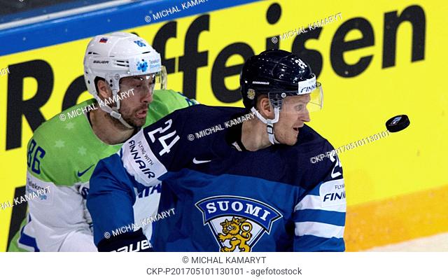 From left: SABAHUDIN KOVACEVIC (SVN) and JANI LAJUNEN (FIN) in action during the match Finland vs Slovenia during the Ice Hockey World Championships in Paris