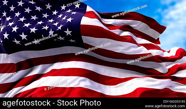 close up view of the american flag waving in the wind. Clear sky in the background. Selective focus. Democracy, independence and election day