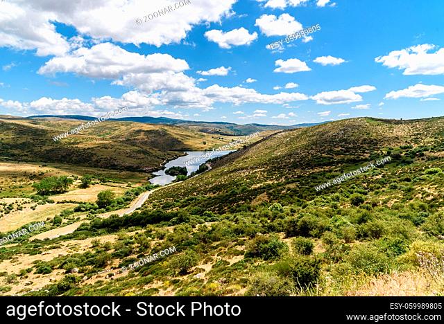 Reservoir dam a sunny day of summer. Las Navas del Marques, Avila