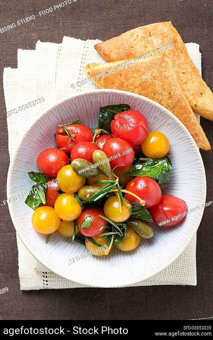 Cherry tomato and caper salad with puff pastries