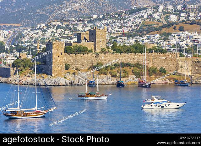 Bodrum, Mugla Province, Turkey. View across harbour to Castle of St. Peter. Bodrum is the ancient Halicarnassus. As of 2016 the Castle of St
