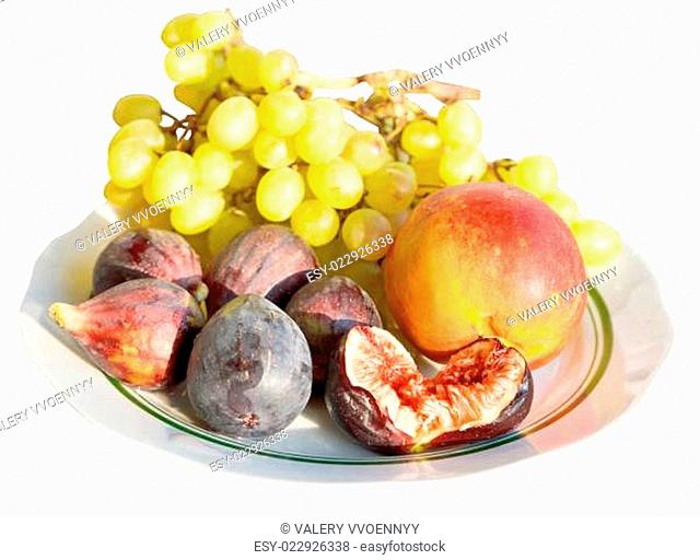 autumn seasonal fruits on plate isolate
