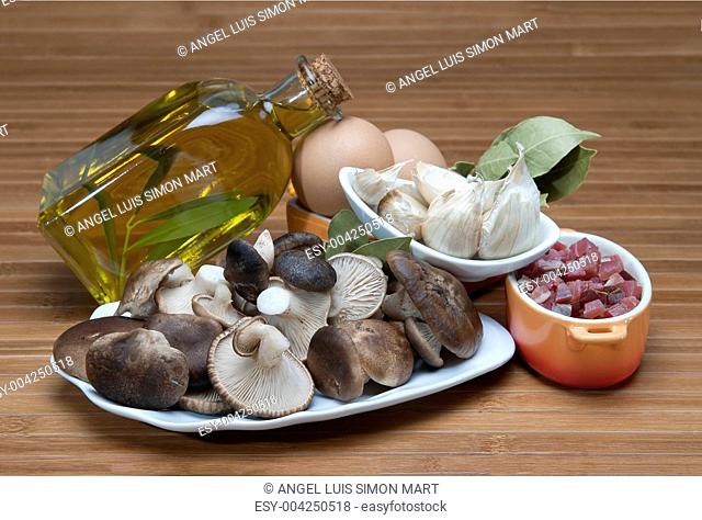 Mushrooms, eggs, ham and olive oil to cook