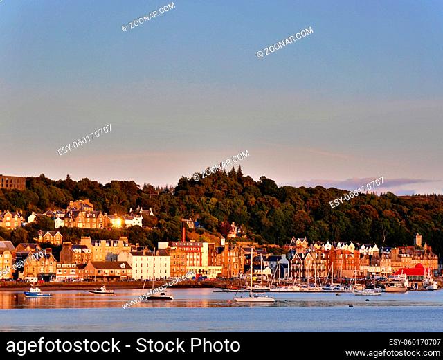 View of boats in the bay and houses around harbour, Oban, Scotland. High quality photo