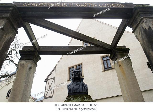 A bust of Martin Luther, German theologist and key figure of the Protestant Reformation, seen in front of his birthplace in Luther's hometown of Eisleben