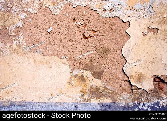 Ancient crumbled wall background. Vanishing old architectural building