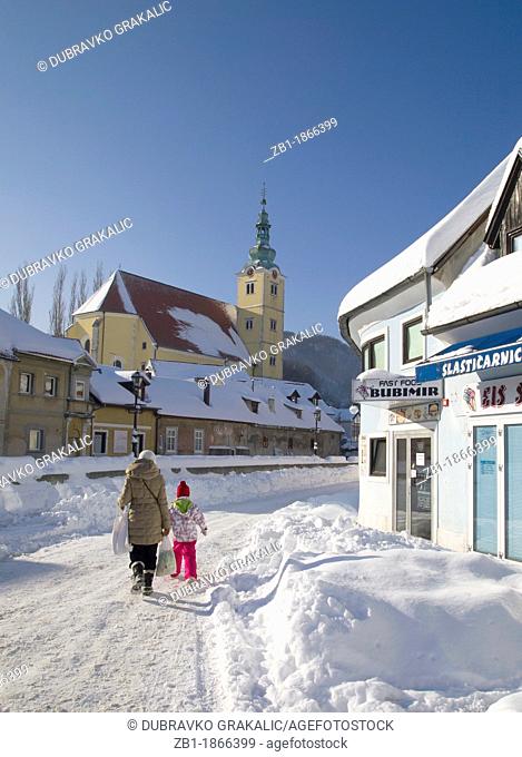 Winter scenery from Croatia: St Anastasia church and houses covered with fresh snow, city of Samobor, central Croatia