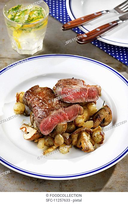 Beef steak with mushrooms and pearl onions
