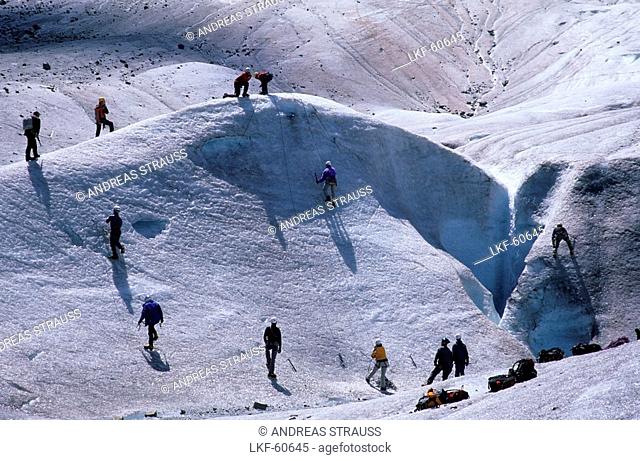 Mountaineerers during training with crampons, glacier of Morteratsch, Bernina, Oberengadin, Grisons, Switzerland