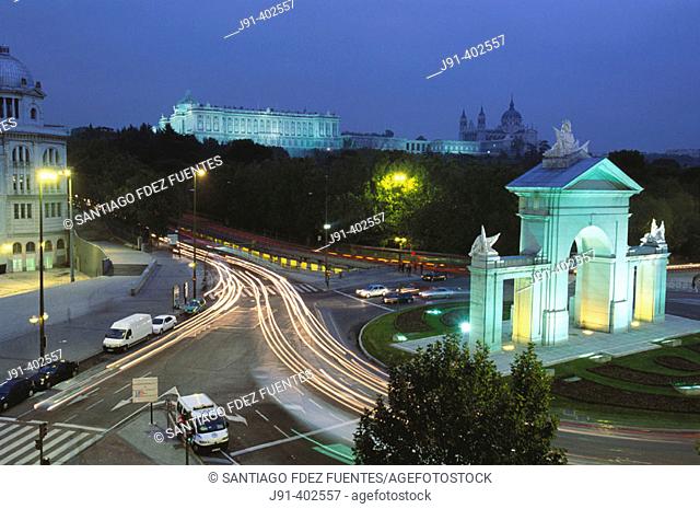 Roundabout, San Vicente town gate with Royal Palace and Almudena cathedral in background. Madrid. Spain