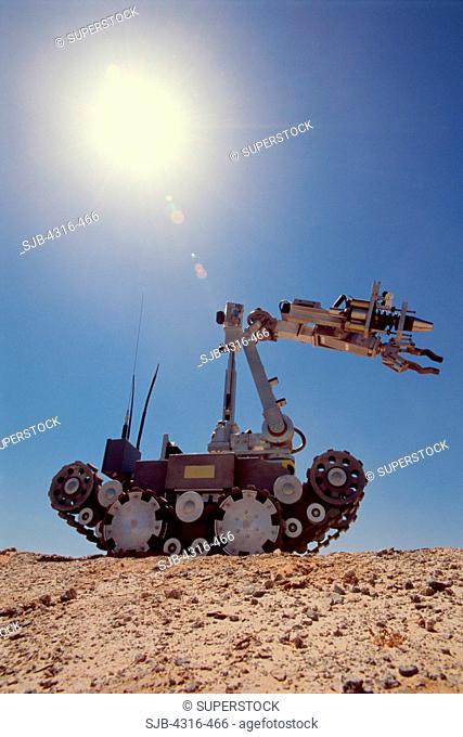The Harsh Desert Sun Shines on an Explosive Ordnance Disposal Robot