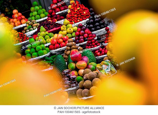 Piles of fruits (apples, mangos, guanabanas, sapotes, plums etc.) are seen arranged at the fruit market of Paloquemao in Bogota, Colombia, 25 November 2017