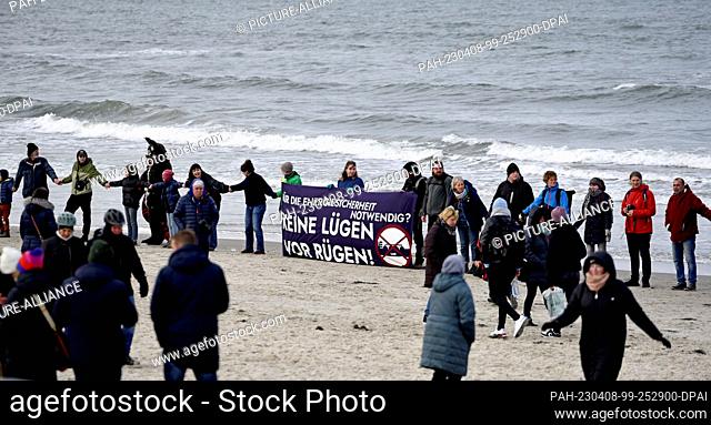 08 April 2023, Mecklenburg-Western Pomerania, Binz: With a banner and the inscription ""Necessary for energy security? No lies off Rügen""