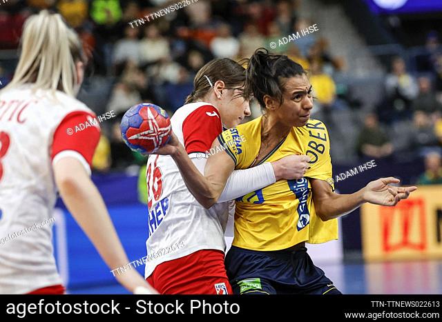 Sweden's Jamina Roberts (R) and Croatia's Mia Brkic (C) in action during the IHF Women's World Championship group A handball match between Sweden and Croatia at...