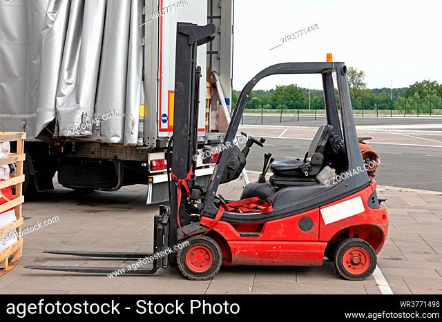 Gas Powered Red Forklift Cargo Truck Outside