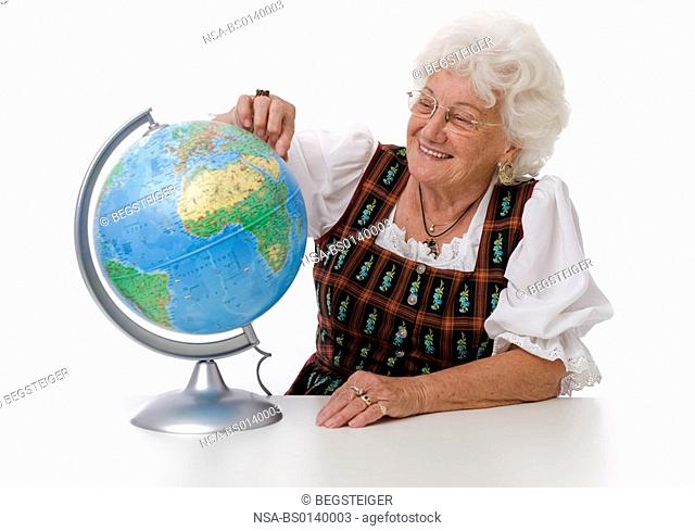 older person with globe