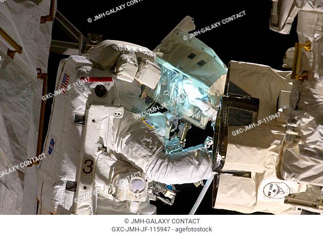 NASA astronaut Andrew Feustel, STS-134 mission specialist, participates in the mission's second session of extravehicular activity (EVA) as construction and...