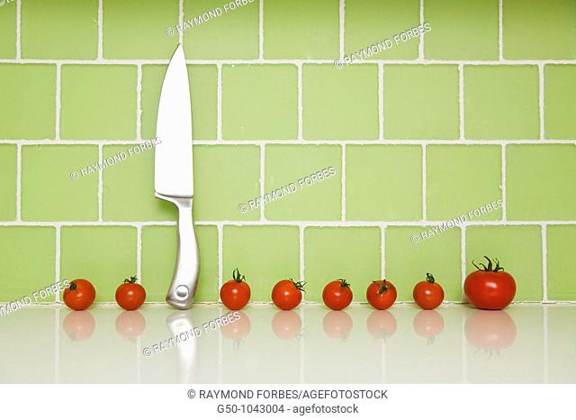 Tomatoes with knife