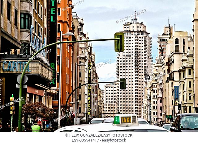 Taxi at Gran Via street, Torre de Madrid in background, Madrid, Spain