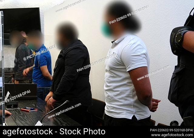 02 June 2022, Baden-Wuerttemberg, Stuttgart: Four men are about to go on trial in a courtroom at Stuttgart Regional Court