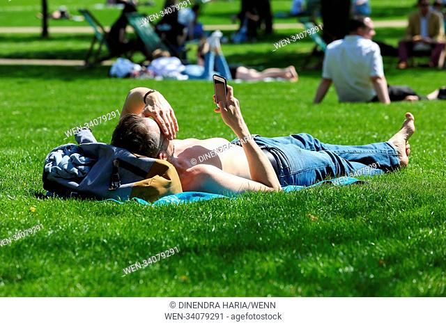 Tourist and Londoners enjoy second day of hot weather in St. James's Park as the temperatures in the capital likely to reach 28 degree celsius