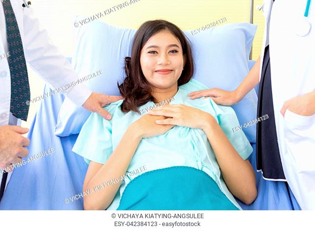 Portrait of female patient Relaxing ans smile in bed of Hospital Ward