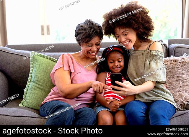 Multi-generation mixed-race family enjoying their time at home