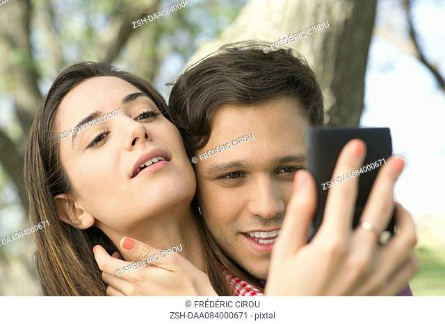 Couple posing for selfie outdoors