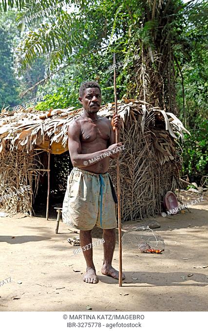 Baka man, pygmy, with a hunting spear in the jungle