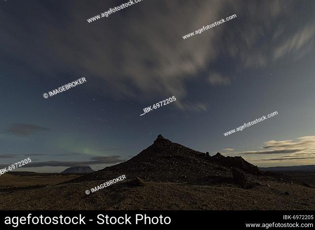 Faint northern lights (Aurora Borealis) and star trails, in the background table volcano Herðubreið or Herdubreid, Icelandic highlands, Iceland, Europe