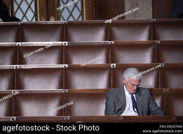 A member of the United States House Representatives sits amongst empty seats after some of his colleagues walks out during a speech by United States...