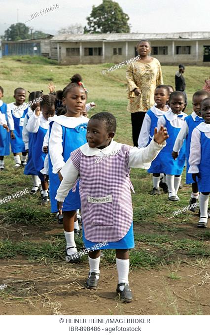 Pre-school children wearing uniforms during morning exercise, Buea, Cameroon, Africa