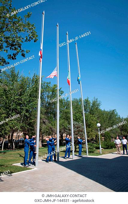 At the Cosmonaut Hotel crew quarters in Baikonur, Kazakhstan, the Expedition 52-53 prime and backup crewmembers raised the flags of the U.S