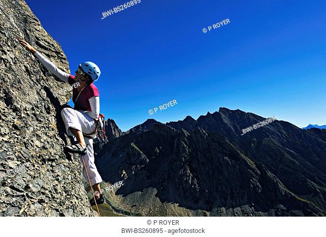 girl climbing the mountain of Pierra Menta, France, Savoie