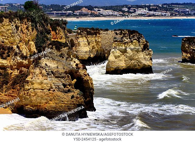 Europe, Portugal, Algarve, Western Algarve, Lagos, Atlantic Ocean Coast seen from Pinhao beach cliffs, far top background - long sandy beach Meia Praia