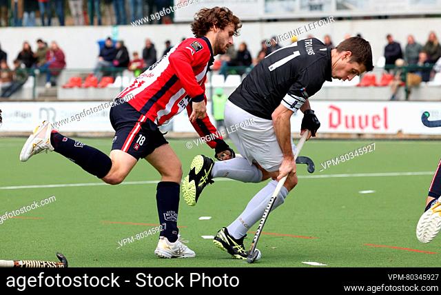 Leopold's Jean-Baptiste Forgues and Racing's Jerome Truyens fight for the ball during a hockey game between Royal Leopold Club and Royal Racing Club Bruxelles