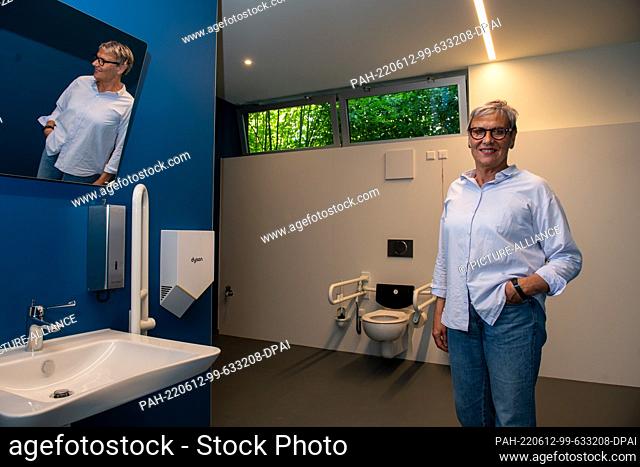 03 June 2022, Baden-Wuerttemberg, Ulm: Principal Cornelia Euchner stands in a unisex restroom at the Sägefeldschule in the Wiblingen district