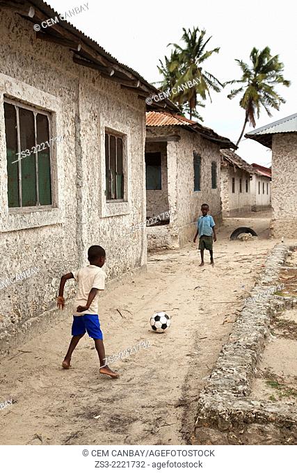 Children playing with the ball in the village, Jambiani, Zanzibar Island, Tanzania, Indian Ocean, East Africa