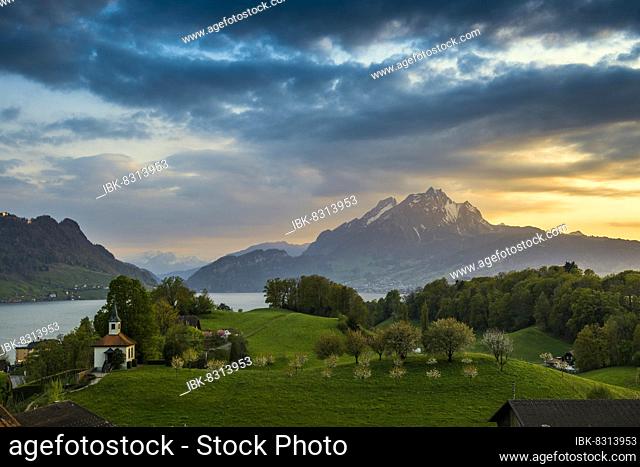 Panorama with lake and mountains, sunset, Eggisbühl Chapel, Pilatus in the back, Hertenstein, near Weggis, Lake Lucerne, Canton Lucerne, Switzerland, Europe
