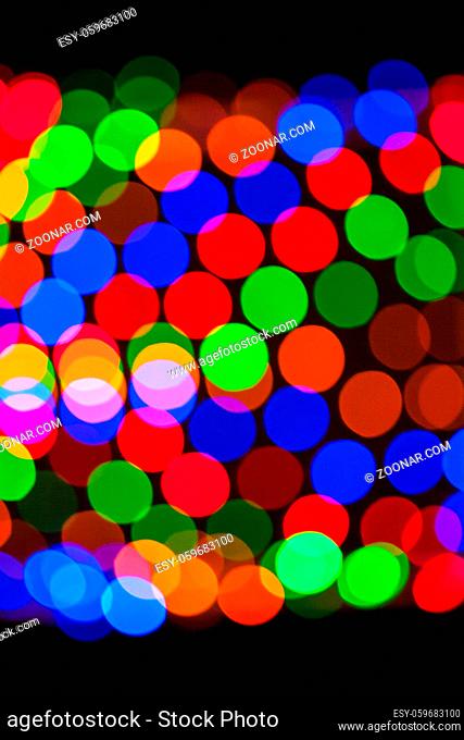 Multicolored defocused bokeh lights background. Abstract blurs