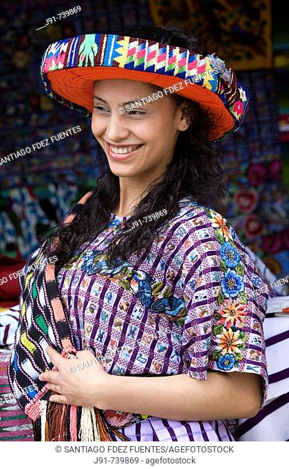 Young woman wearing a 'huipil' and a traditional hat, Santiago Atitlan, Solola department, Guatemala