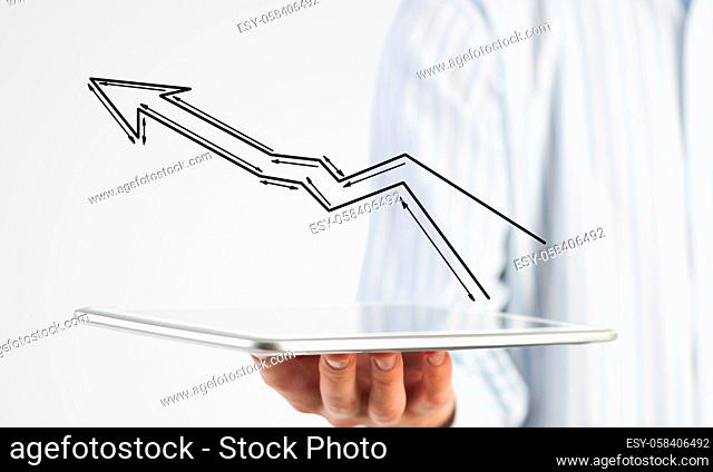 Close view of businessman holding tablet presenting growth concept