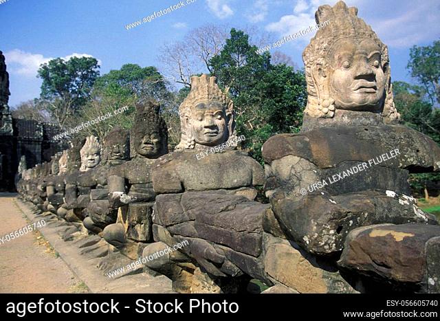 stone face at the Bridge of the south gate to the Angkor Tom city in the Temple City of Angkor near the City of Siem Reap in the west of Cambodia