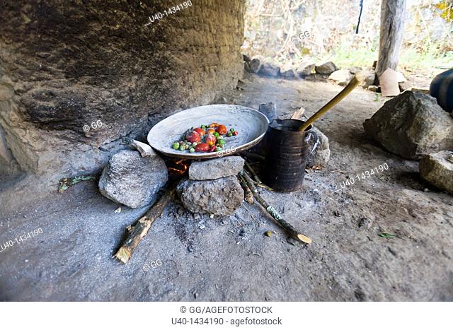 Guatemala, roasting vegetables on a comal
