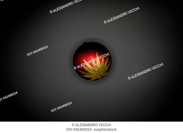 Christmas wallpaper background of red and golden celebration tree ball isolated on black background